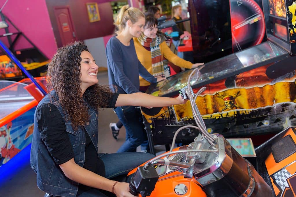 woman playing at family entertainment center